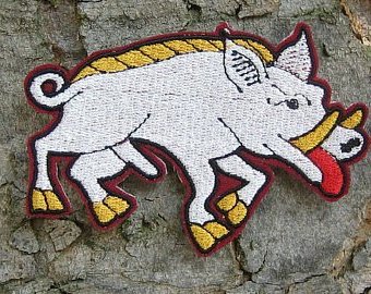 Embroidered livery badge: white boar of Gloucester